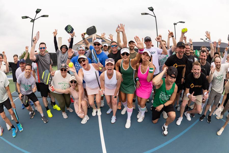 Attendees at a pickleball event during The Gathering